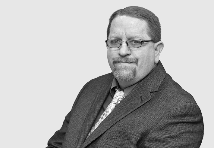 A headshot image of Kevin Hecksher