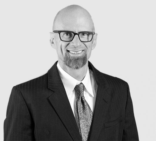 A headshot image of Stephen Mack