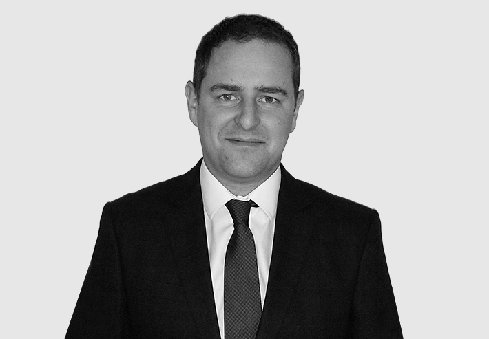 A headshot image of Greg Owens
