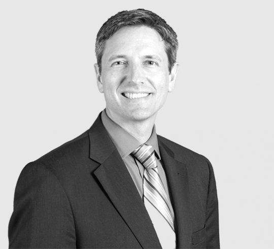 A headshot image of Jason A. Sutula